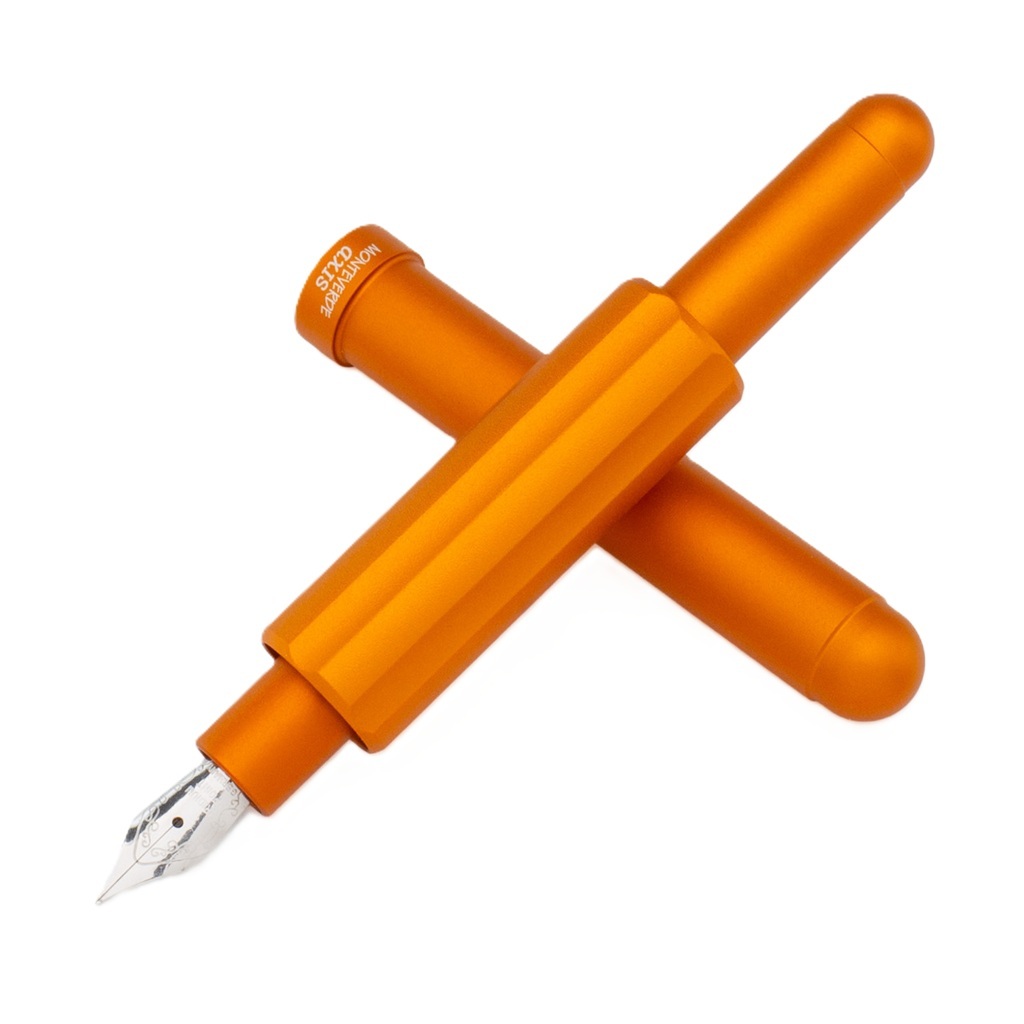 Woman hands writing on paper agenda on a table at home